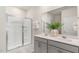 Modern bathroom featuring a double vanity, glass shower, and stylish fixtures at 165 Babbling Creek Dr, Youngsville, NC 27596