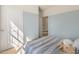 Inviting bedroom showcasing natural light, neutral carpet, a baseball-themed pillow, and calming wall color at 165 Babbling Creek Dr, Youngsville, NC 27596