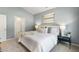 Calming bedroom with neutral colors, soft lighting, and an en-suite bathroom at 165 Babbling Creek Dr, Youngsville, NC 27596