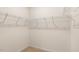 Empty walk-in closet featuring wire shelving and plush carpeting at 165 Babbling Creek Dr, Youngsville, NC 27596