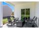 Cozy covered patio with outdoor furniture, perfect for relaxing and entertaining at 165 Babbling Creek Dr, Youngsville, NC 27596