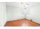 Hardwood floor bedroom with a ceiling fan and natural light at 1702 Pinecrest St, Burlington, NC 27215