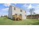 Exterior of home with a wooden deck and stairs in backyard with healthy green grass at 195 Babbling Creek Dr, Youngsville, NC 27596