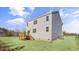 Exterior of home with a wooden deck and stairs in backyard with healthy green grass at 195 Babbling Creek Dr, Youngsville, NC 27596