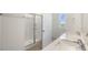 Modern bathroom with double sinks, a shower, and bright natural light at 195 Babbling Creek Dr, Youngsville, NC 27596