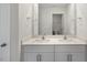 Bright bathroom features a double sink vanity with modern faucets and light countertops at 195 Babbling Creek Dr, Youngsville, NC 27596