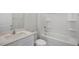 Bathroom featuring a white sink vanity, toilet, and shower with silver hardware at 195 Babbling Creek Dr, Youngsville, NC 27596