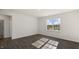 Spacious bedroom with hardwood floors, abundant natural light, and a bathroom entrance at 195 Babbling Creek Dr, Youngsville, NC 27596