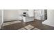 Bright kitchen features stainless appliances, white cabinets, and a granite island, offering style and functionality at 195 Babbling Creek Dr, Youngsville, NC 27596