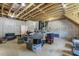 Unfinished attic space with exposed beams, plywood subflooring, and visible insulation, providing ample storage or conversion potential at 201 S Ennis St, Fuquay Varina, NC 27526
