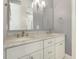 Bathroom vanity with double sinks, modern fixtures, and a well-lit mirror at 201 S Ennis St, Fuquay Varina, NC 27526