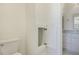 Bathroom featuring a toilet and vanity with a hidden storage cabinet, adding convenience and organization to the space at 201 S Ennis St, Fuquay Varina, NC 27526