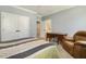 Comfortable bedroom featuring a desk, a recliner and neutral decor, perfect for relaxing and enjoying your personal space at 201 S Ennis St, Fuquay Varina, NC 27526