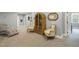 A well-lit bonus room with chairs, carpeted floor, and natural lighting at 201 S Ennis St, Fuquay Varina, NC 27526