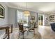 Inviting dining area with a round glass table, decorative rug, and natural light at 201 S Ennis St, Fuquay Varina, NC 27526