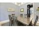 Cozy dining room featuring hardwood floors, neutral walls, and a classic chandelier at 201 S Ennis St, Fuquay Varina, NC 27526