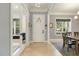 Welcoming entryway features stylish flooring, a striking front door, and sunlit windows at 201 S Ennis St, Fuquay Varina, NC 27526