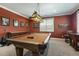 Entertain in this game room featuring a pool table, bar area, and stylish decor for a complete recreational space at 201 S Ennis St, Fuquay Varina, NC 27526