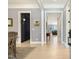 Elegant hallway featuring hardwood floors, neutral walls, and sophisticated doorways at 201 S Ennis St, Fuquay Varina, NC 27526