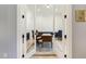 Bright home office with French doors features hardwood floors and sophisticated decor at 201 S Ennis St, Fuquay Varina, NC 27526