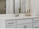 Bathroom vanity featuring white cabinets, a white countertop, a mirror, and chrome hardware at 2024 Cross Bones Blvd # Homesite 25, Durham, NC 27703
