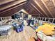 Unfinished attic space with wooden beams, ideal for storage or renovation, stairs visible at 207 Wood Cir, Chapel Hill, NC 27514