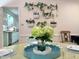 Dining room decor with plants on the wall and light color wooden table at 207 Wood Cir, Chapel Hill, NC 27514