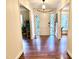 Inviting foyer with glass paneled front door and hardwood flooring, creating an elegant entryway at 207 Wood Cir, Chapel Hill, NC 27514