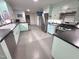 Well-lit kitchen with stainless steel appliances and light color cabinets, creating a clean and functional space at 207 Wood Cir, Chapel Hill, NC 27514