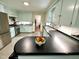 Modern kitchen equipped with stainless steel appliances and light color cabinets, designed for cooking and gathering at 207 Wood Cir, Chapel Hill, NC 27514