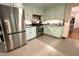 Bright kitchen features modern stainless steel appliances and light green cabinetry at 207 Wood Cir, Chapel Hill, NC 27514