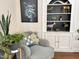 Cozy reading corner featuring a comfortable chair and built-in shelves at 207 Wood Cir, Chapel Hill, NC 27514