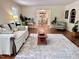 Bright living room featuring hardwood floors and a view of the dining room at 207 Wood Cir, Chapel Hill, NC 27514