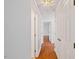 Hallway with hardwood floors and white doors at 209 E Church St, Creedmoor, NC 27522