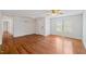 Spacious living room with hardwood floors and ample natural light at 209 E Church St, Creedmoor, NC 27522