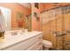 Bright bathroom featuring a white vanity, peach walls and a beach-themed shower curtain with adorable seagull designs at 229 Hocutt Farm Dr, Clayton, NC 27527