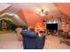 Finished bonus room featuring a ceiling fan, a large television, and a comfortable seating area at 229 Hocutt Farm Dr, Clayton, NC 27527