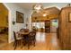 Charming dining area features natural lighting, hardwood floors, a decorative light fixture and connections to other living spaces at 229 Hocutt Farm Dr, Clayton, NC 27527