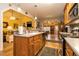 Well-lit kitchen area with stainless steel appliances and hardwood floors that open into dining and living areas at 229 Hocutt Farm Dr, Clayton, NC 27527