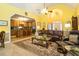 Open-concept living room with vaulted ceilings, fireplace, and access to kitchen at 229 Hocutt Farm Dr, Clayton, NC 27527
