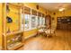 Bright living room with large windows, providing ample natural light and showcasing hardwood floors and wicker furniture at 229 Hocutt Farm Dr, Clayton, NC 27527