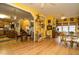 Spacious open-concept living space featuring large windows, hardwood floors, and seamless transitions between living areas at 229 Hocutt Farm Dr, Clayton, NC 27527
