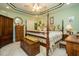 Spacious main bedroom featuring a trey ceiling, a four-poster bed, and hardwood furnishings and decor at 229 Hocutt Farm Dr, Clayton, NC 27527
