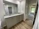 Bathroom featuring a tub and double sink with granite countertops and tile floor at 265 Eason Creek Way, Clayton, NC 27527
