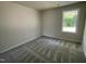 Bedroom featuring a window and carpet at 265 Eason Creek Way, Clayton, NC 27527