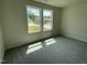 Bedroom featuring two windows at 265 Eason Creek Way, Clayton, NC 27527