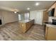 Kitchen featuring granite countertops, stainless steel appliances, and hardwood floors at 265 Eason Creek Way, Clayton, NC 27527