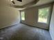 Bright main bedroom featuring carpeted floors, recessed lighting and large windows at 265 Eason Creek Way, Clayton, NC 27527