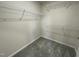 Empty walk-in closet with carpet and shelving at 265 Eason Creek Way, Clayton, NC 27527