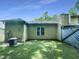 Backyard view of home with a grassy lawn at 27 Stonewall Way, Durham, NC 27704